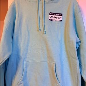 Light Blue Hoodie with 'Nobody' Patch